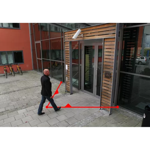man walking into a building