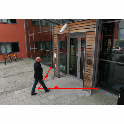 man walking into a building