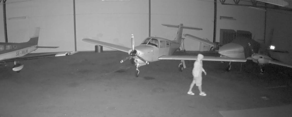 Man walking by an airplane