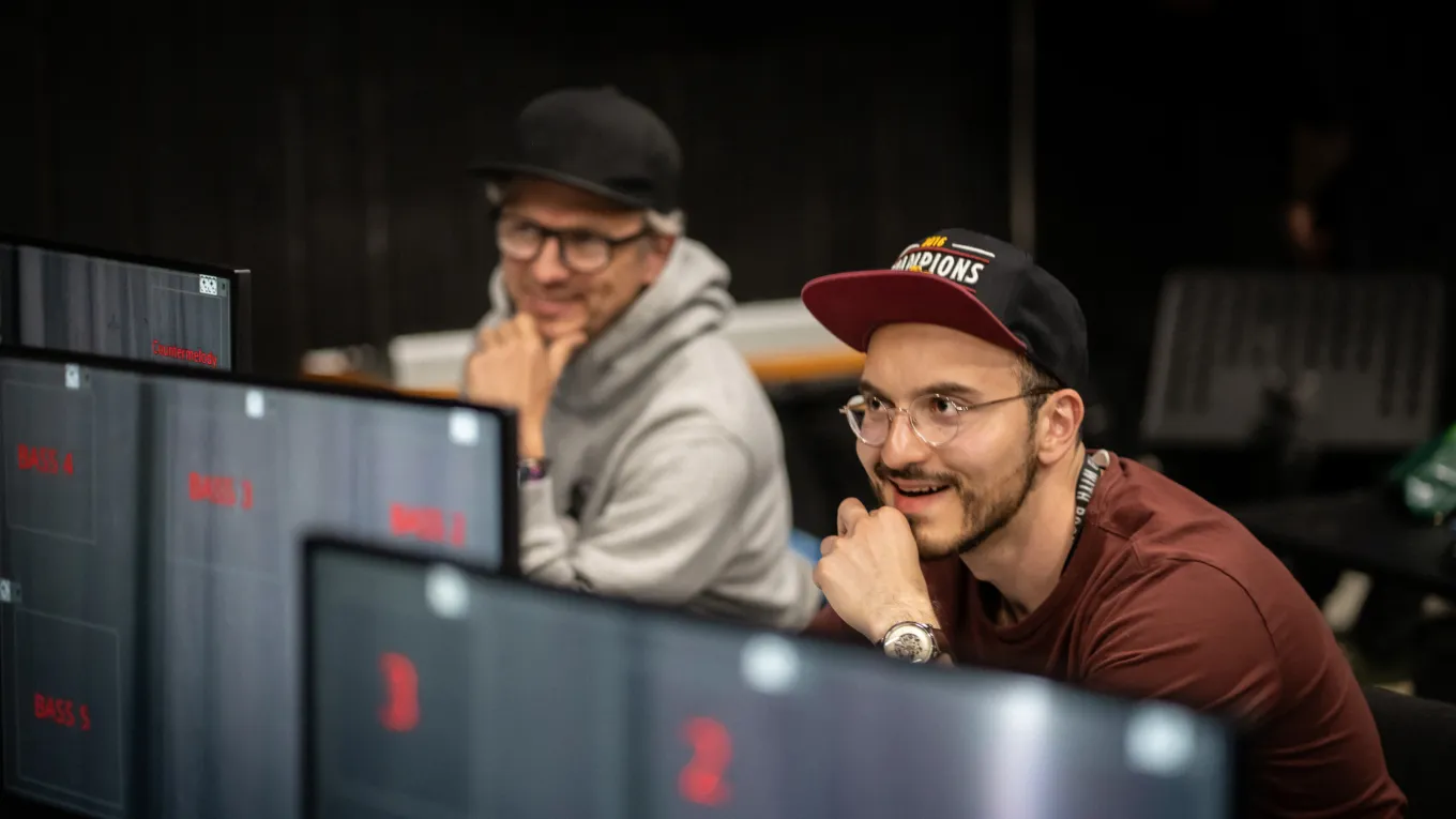 Two men working on creating the object detection orchestra