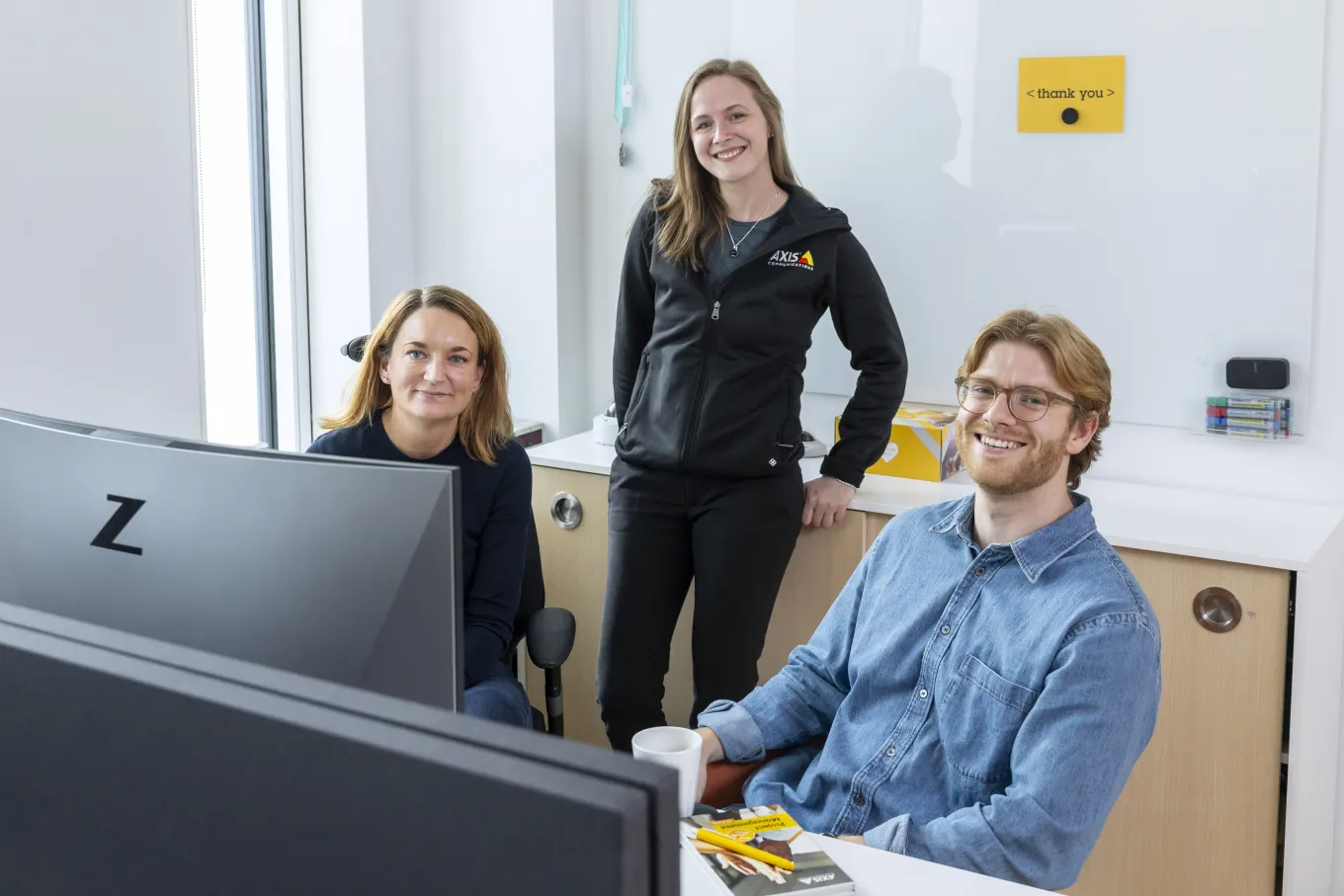 Isabel, Emma and Rikard smiling at the camera