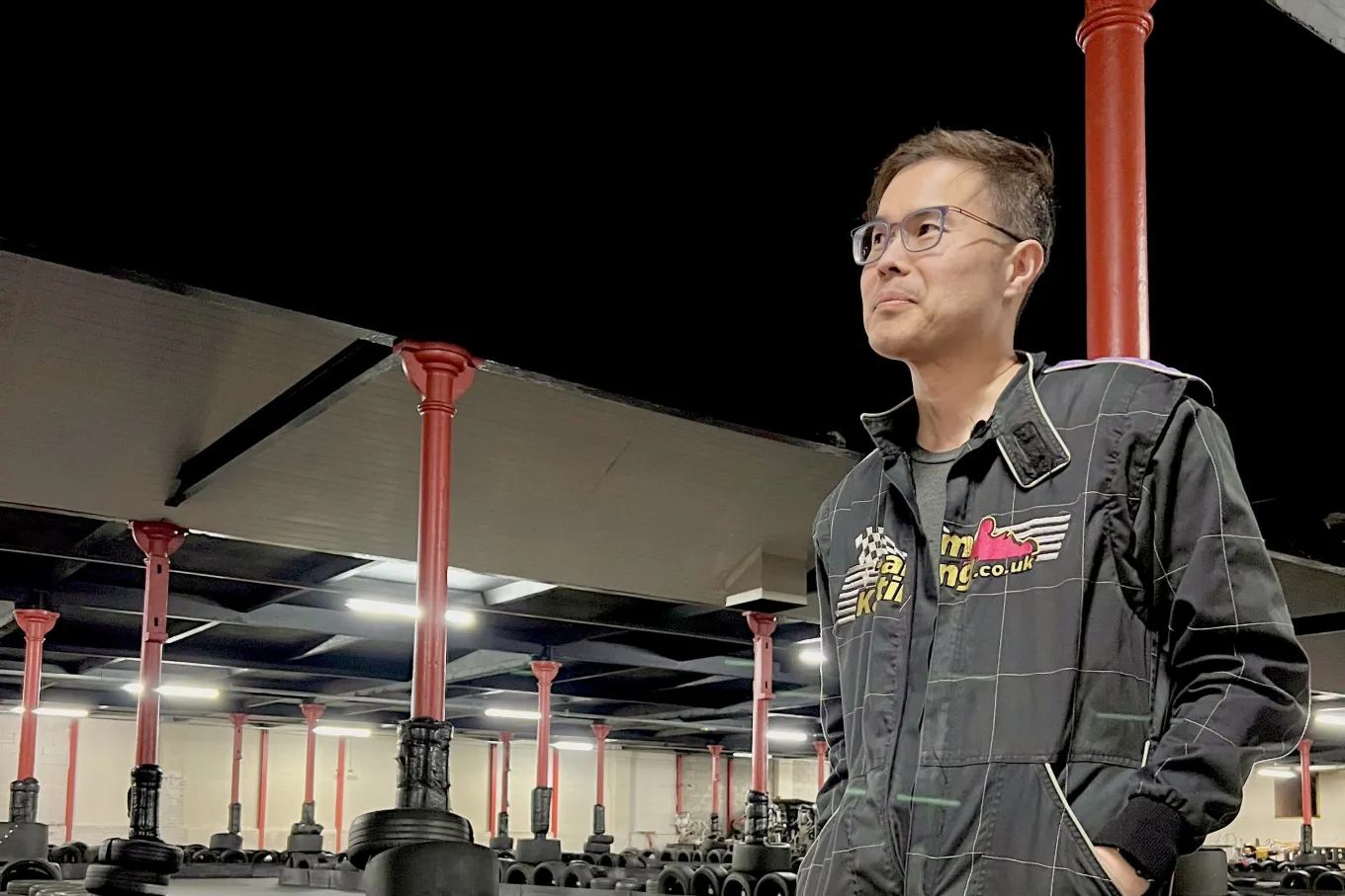 Peter Chiu posing in a go-kart jacket 