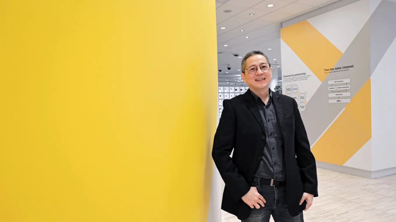 Johny Dermawan posing in front of the camera 