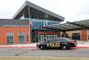 Exterior of Putnam City School District middle school with police cruiser in front